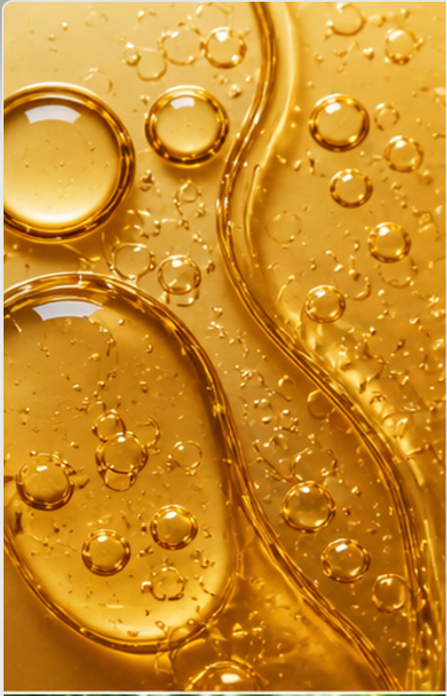 Close-up of golden liquid representing Acer saccharum (sugar maple) extract used in skincare