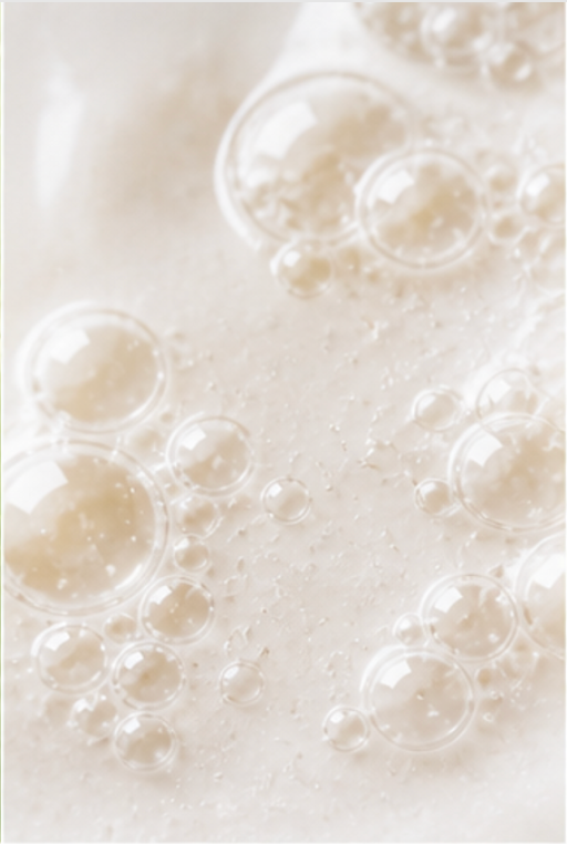 Close-up of frothy white liquid with bubbles representing Poria Cocos