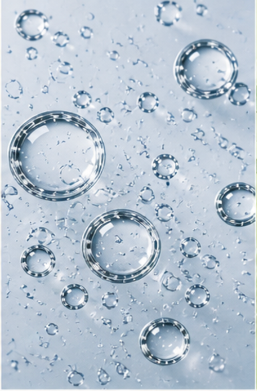 Close-up of water droplets on a glass surface representing sodium hyaluronate